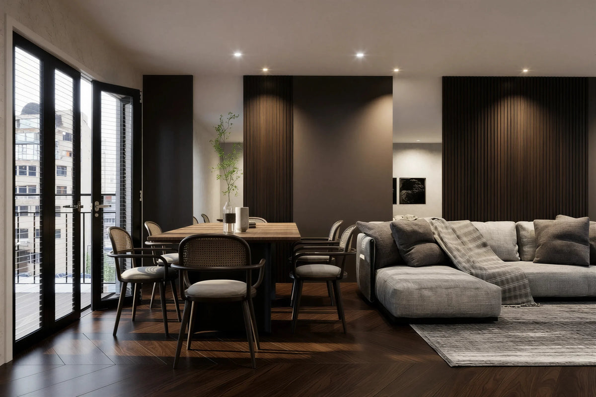 Audley walnut slatted wall panel in London: floor-to-ceiling tobacco walnut slat panels between plain bays along the long wall of an open-plan living and dining room, with a dining table and a grey sofa. Made to measure by Metro Home Interiors