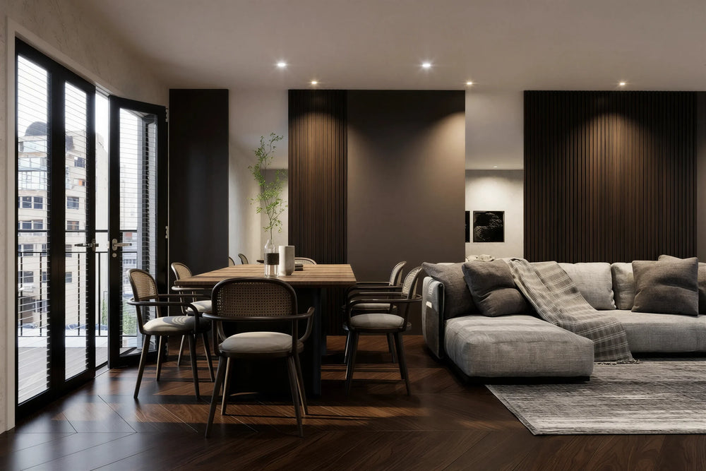 Audley walnut slatted wall panel in London: floor-to-ceiling tobacco walnut slat panels between plain bays along the long wall of an open-plan living and dining room, with a dining table and a grey sofa. Made to measure by Metro Home Interiors