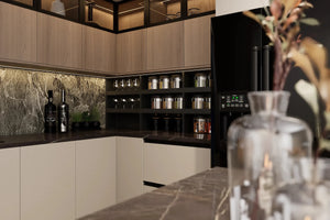 Blackheath Slab Island Kitchen in London: matt white slab base units with oak wall units, a black marble island and splashback, and a black fridge-freezer; the black marble splashback and lit shelf behind the island. Made to measure by Metro Home Interiors