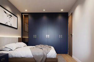 Built in wardrobes around a bed — Frankfurt doors in deep ink blue