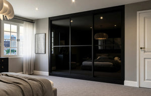 Cambridge Glass and Mirror Sliding Wardrobe in London, Equal 2 black glass door layout: black glass and mirror doors with black profiles, made to measure by Metro Home Interiors