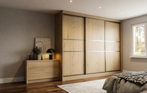 Canterbury Woodgrain Sliding Wardrobe in London, Central 400 door layout: light oak woodgrain doors with black profiles and mirror options, made to measure by Metro Home Interiors