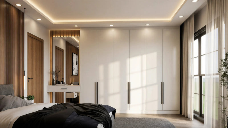 Delphine fitted bedroom furniture in London: cream handleless wardrobes with an oak-slat feature wall and a lit dressing niche; the handleless wardrobe run, oak-slat feature wall and lit dressing niche. Made to measure by Metro Home Interiors
