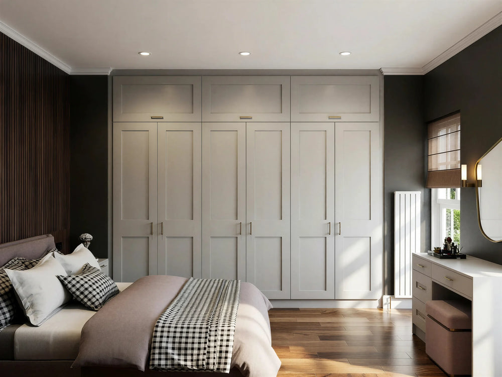 Hartford MDF painted fitted wardrobe in London: soft grey 90mm shaker doors, a floor-to-ceiling wardrobe run beside the window and a matching dressing table, made to measure by Metro Home Interiors