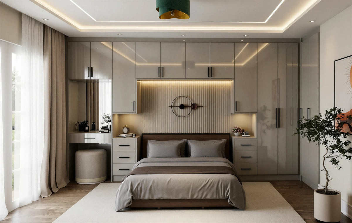 High gloss fitted wardrobe in light grey wrapping the bed wall, with a dressing table, lit fluted headboard panel and slim black handles, made to measure in London