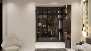 Knightsbridge glass fitted wardrobe in London: matt black aluminium frames with smoked toughened glass over a lit walnut alcove interior