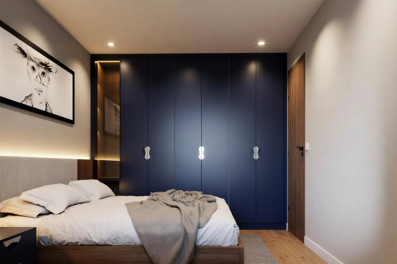 Luxury fitted wardrobes around a bed — Seymour doors in deep blue