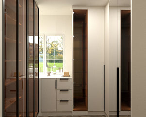 Regents Park walk-in wardrobe in London, fourth view with the doors closed: black framed glass doors either side of the dressing table under the window. Made to measure by Metro Home Interiors