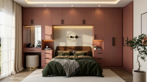 Sandringham over-bed wardrobe in London seen straight on: the full terracotta run from dressing table to far tower with the lit headboard panel between the bedsides. Made to measure by Metro Home Interiors