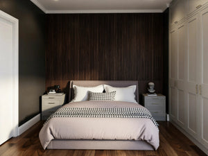 Wellington MDF painted fitted wardrobe in London: greige mock in-frame shaker doors, wardrobes either side of the bed with matching bedside chests against a dark slatted wall, made to measure by Metro Home Interiors