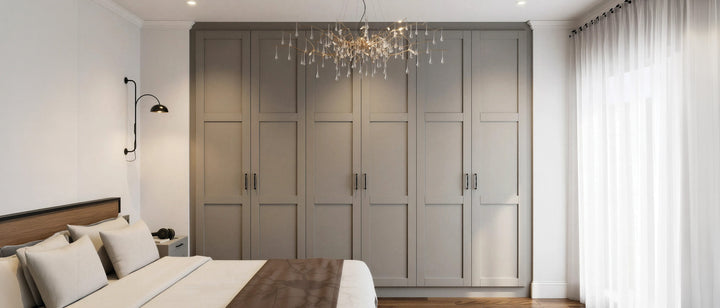 Taupe five-piece shaker fitted wardrobes with slim bar handles along a bedroom wall, made to measure in London