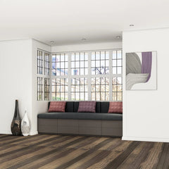 Ashdown bay window seat: a grey upholstered day-bed with deep drawers beneath, built into an angled bay of leaded windows