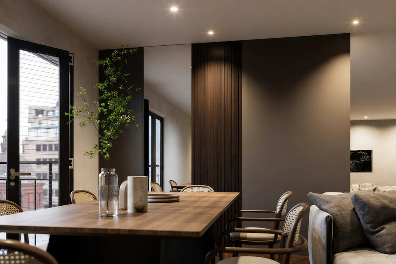Audley walnut slatted wall panel in London seen from the dining table: the tobacco walnut slat panel beside the terrace doors, with the sofa beyond. Made to measure by Metro Home Interiors