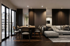 Audley walnut slatted wall panel in London: floor-to-ceiling tobacco walnut slat panels between plain bays along the long wall of an open-plan living and dining room, with a dining table and a grey sofa. Made to measure by Metro Home Interiors