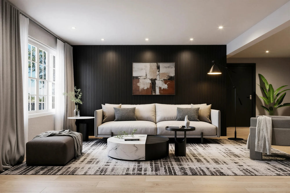 Brook black oak slatted wall panel in London: floor-to-ceiling black oak slats across the whole sofa wall of a bright living room, with a pale sofa, a painting and a bay window. Made to measure by Metro Home Interiors