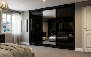 Cambridge Glass and Mirror Sliding Wardrobe in London, Equal 3 black glass door layout: black glass and mirror doors with black profiles, made to measure by Metro Home Interiors