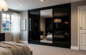 Cambridge Glass and Mirror Sliding Wardrobe in London, Full Panel black glass door layout: black glass and mirror doors with black profiles, made to measure by Metro Home Interiors