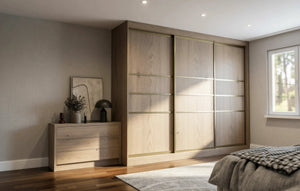 Canterbury Woodgrain Sliding Wardrobe in London, Central 3 door layout: light oak woodgrain doors with black profiles and mirror options, made to measure by Metro Home Interiors