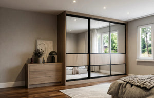 Canterbury Woodgrain Sliding Wardrobe in London, Low 400 door layout: light oak woodgrain doors with black profiles and mirror options, made to measure by Metro Home Interiors