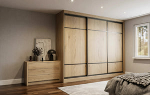 Canterbury Woodgrain Sliding Wardrobe in London, Wide 400 door layout: light oak woodgrain doors with black profiles and mirror options, made to measure by Metro Home Interiors