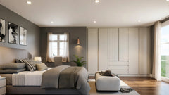 Clementine fitted bedroom furniture in London: cream slab wardrobe wall with a drawer bank and a gallery wall; the cream slab wardrobe wall with its drawer bank beside the bed. Made to measure by Metro Home Interiors