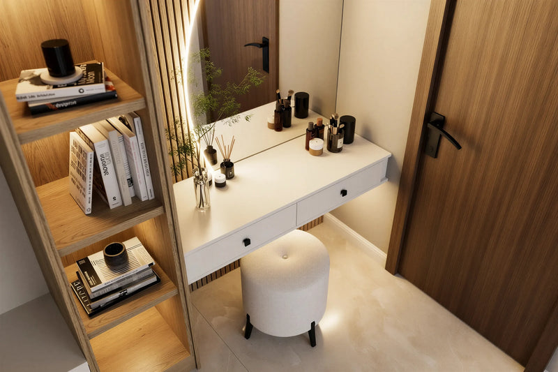 Curzon dressing table in London, close up: the white push-to-open drawers, the lit round mirror and the oak shelving tower with books and bottles. Made to measure by Metro Home Interiors