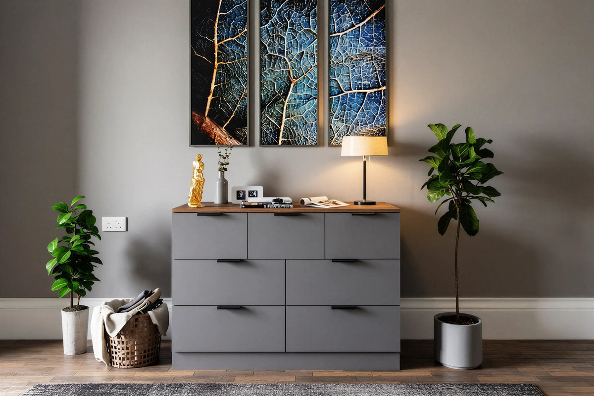 Greenwich seven-drawer chest in grey with a walnut top and black bar handles, under two framed prints