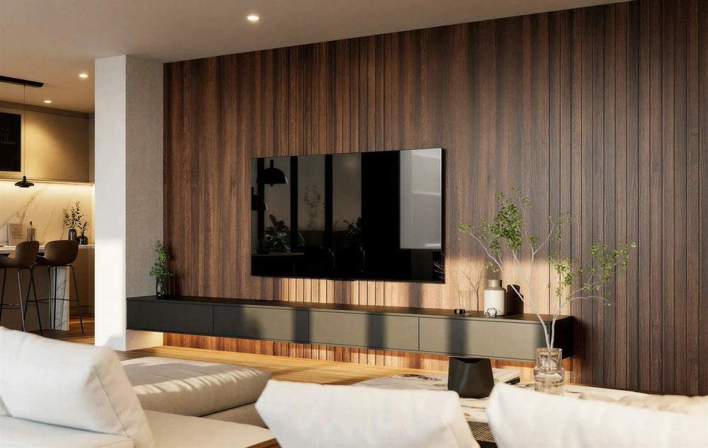 Harley slatted media wall in London: a floor-to-ceiling walnut slatted panel carrying the television, with a long floating charcoal console with push-to-open drawers beneath, in an open-plan living room. Made to measure by Metro Home Interiors
