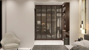 Knightsbridge glass fitted wardrobe in London: brushed bronze aluminium frames with smoked toughened glass over a lit walnut alcove interior