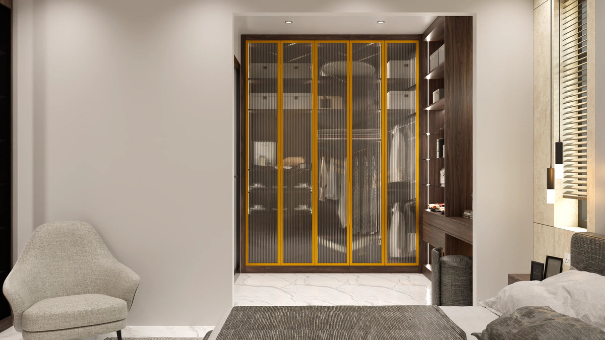 Knightsbridge glass fitted wardrobe in London: champagne aluminium frames with smoked toughened glass over a lit walnut alcove interior, made to measure by Metro Home Interiors