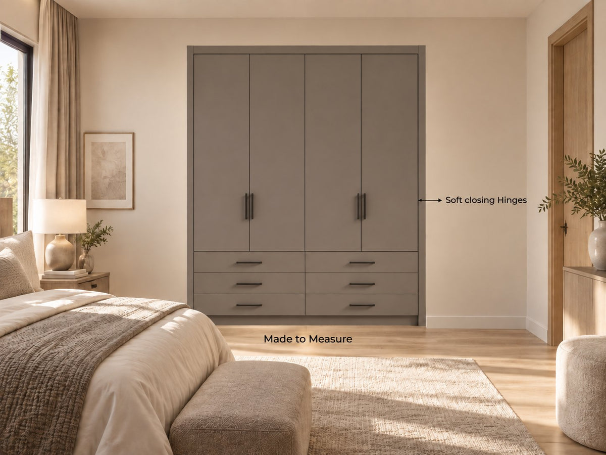 Level 3 Made to Measure: a grey fitted wardrobe with drawers built wall to wall in a bedroom, doors closed, soft-closing hinges