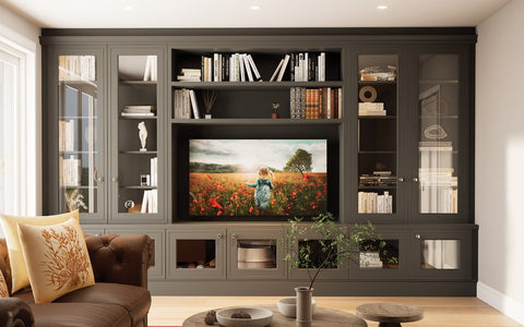 Olive green fitted library and media wall with glazed cabinets, made to measure in London