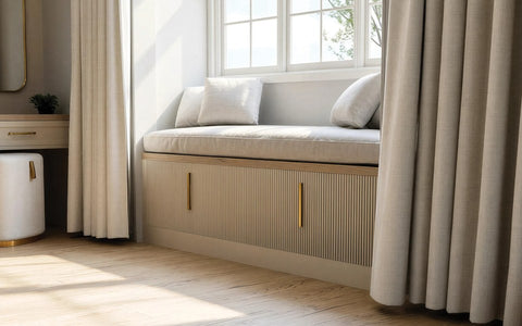 Upholstered fitted window seat with fluted storage drawers, made to measure in London