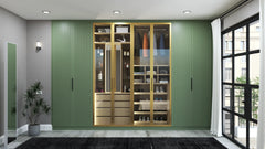 Notting Hill fitted wardrobe in London: sage green fluted doors either side of a lit glass display bay in gold aluminium frames, doors closed