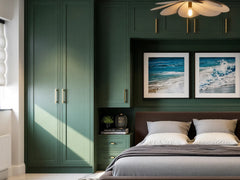 Rainey door detail: forest green painted solid ash Rainey beaded shaker doors with brass bar handles, on a made-to-measure fitted wardrobe in London by Metro Home Interiors
