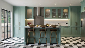 St John's Wood Shaker Island Kitchen in London: sage green in-frame shaker doors with brass handles, a white marble island with breakfast bar, a range cooker and a chevron tiled floor; the island breakfast bar with brass stools and the doors to the garden. Made to measure by Metro Home Interiors