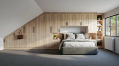 Suffolk bespoke loft fitted wardrobe with floor-to-ceiling storage for a sloping ceiling bedroom in London by Metro. 
